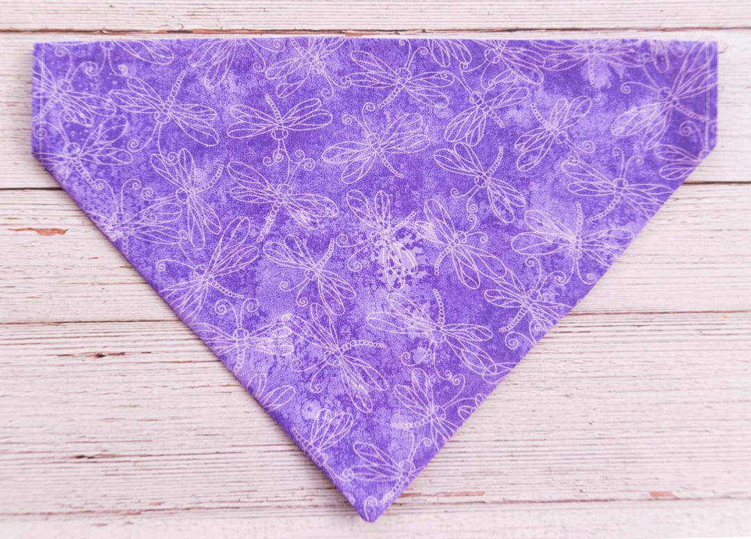 Purple dog bandana with white dragonflies outlined in white