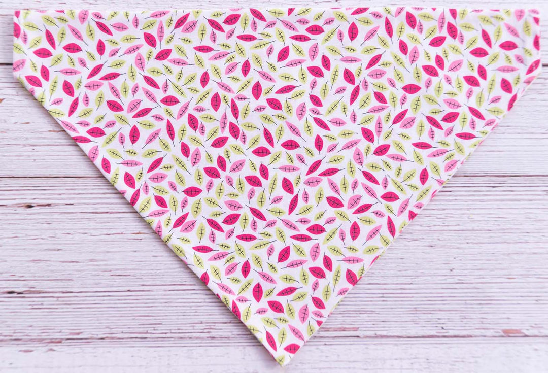 white dog bandana with dark pink and spring green hand drawn flower pattern